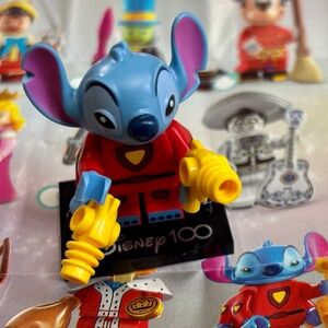 Stitch 626, Disney 100 minifigures with Stand, Accessories, Pamphlet & bag.